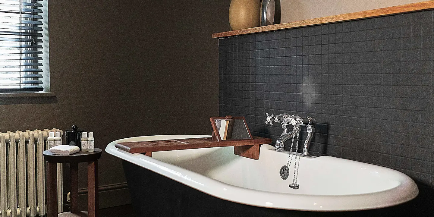 Bathroom featuring a bathtub and radiator.