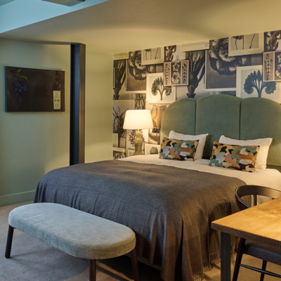 Bedroom featuring a comfortable bed and a window.