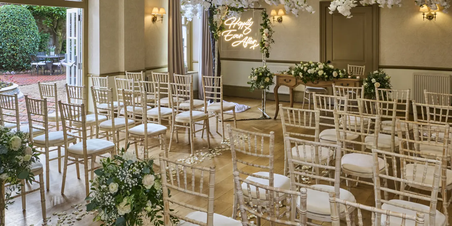 A room filled with numerous chairs and tables.