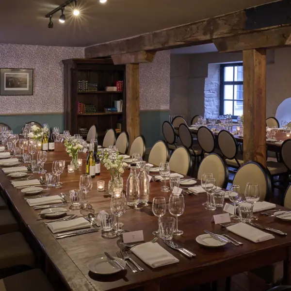 A beautifully arranged dining table with elegantly set place settings.