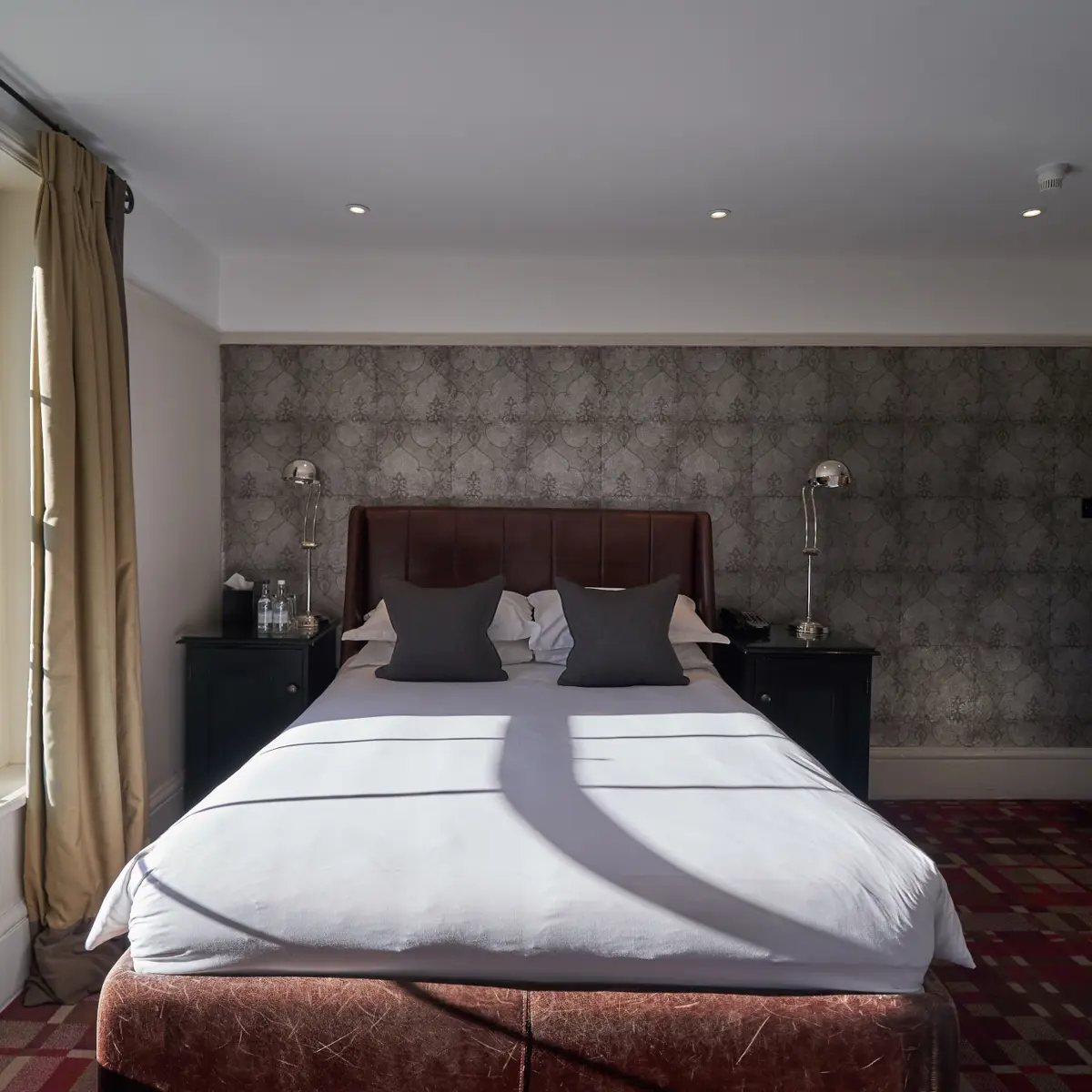 Bedroom featuring a comfortable bed and a window.