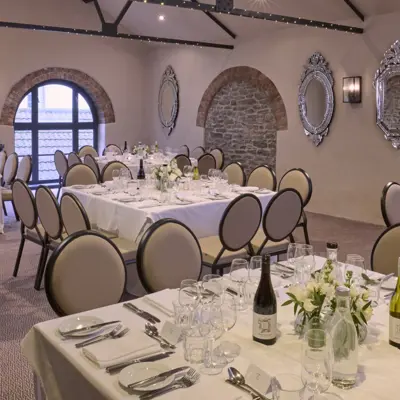 A beautifully arranged dining table with elegant place settings.